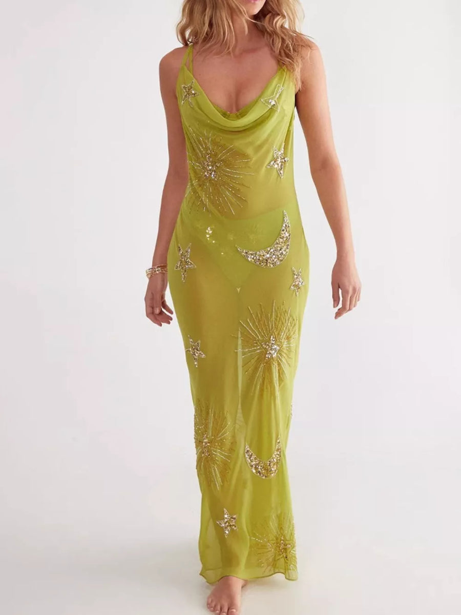 Green sheer cover-up dress with celestial sequin moon and star embellishments.