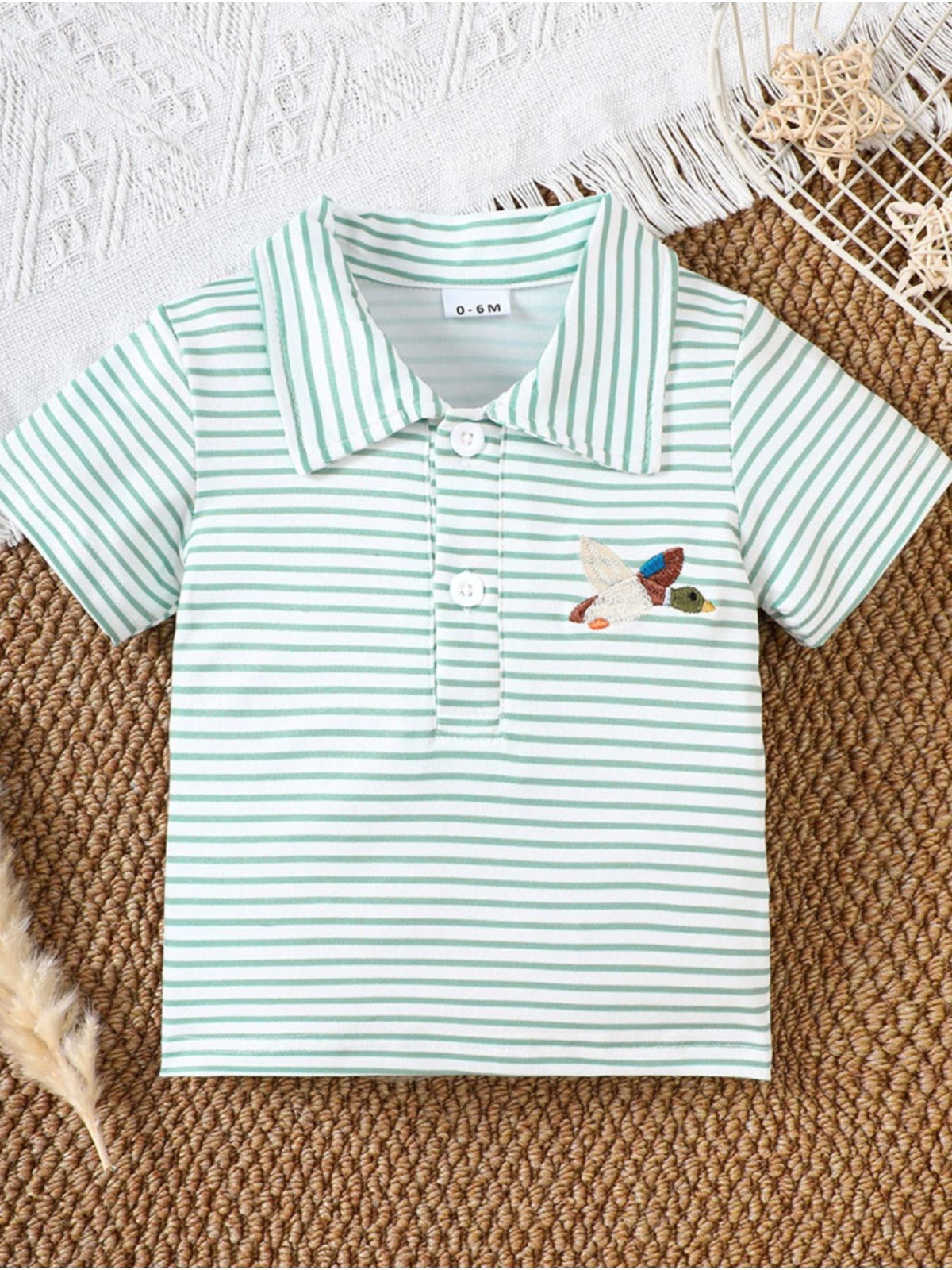 Light Green striped cotton polo shirt for baby with embroidered duck detail.