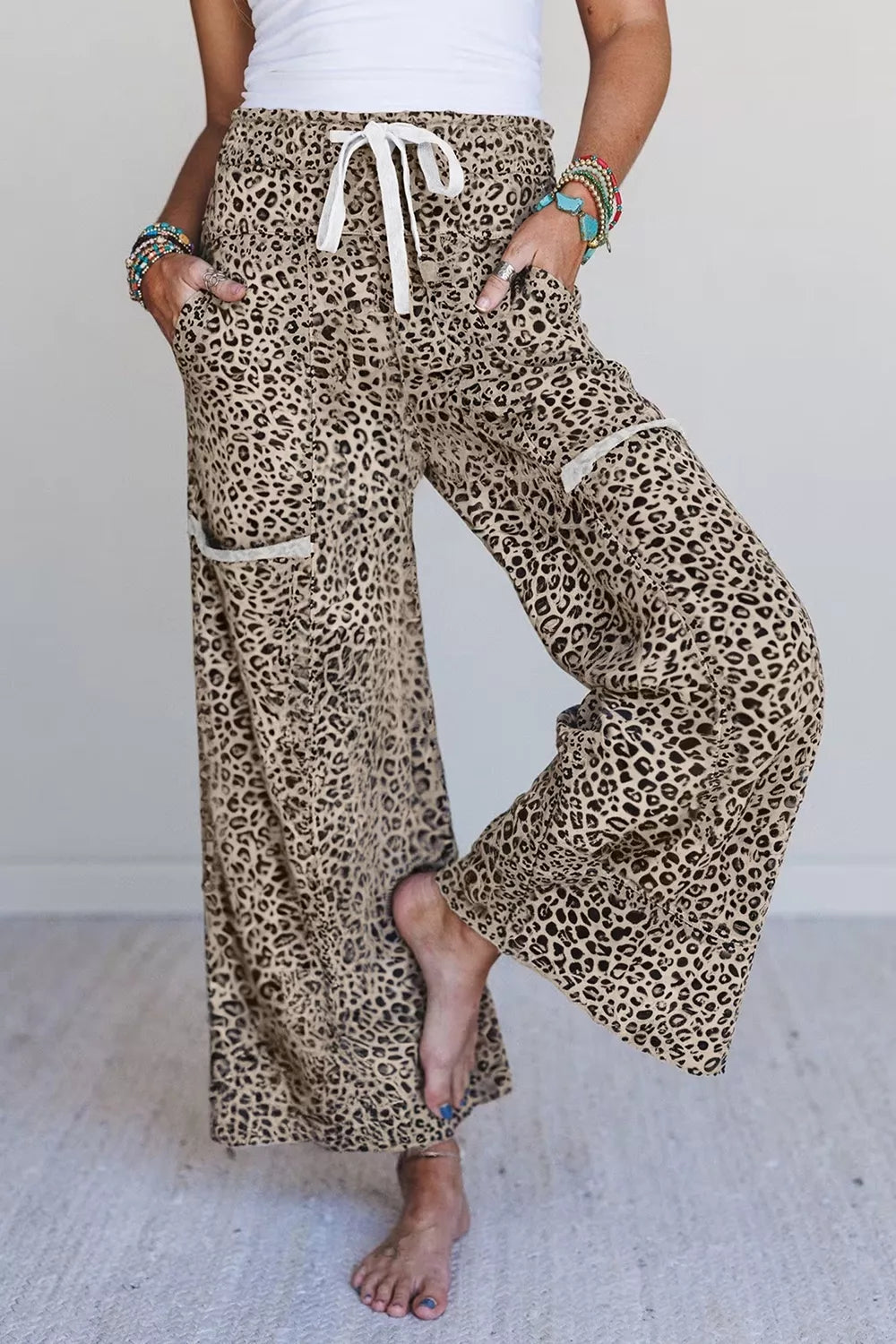 wide-leg pants in tan featuring pocketed and flared fit