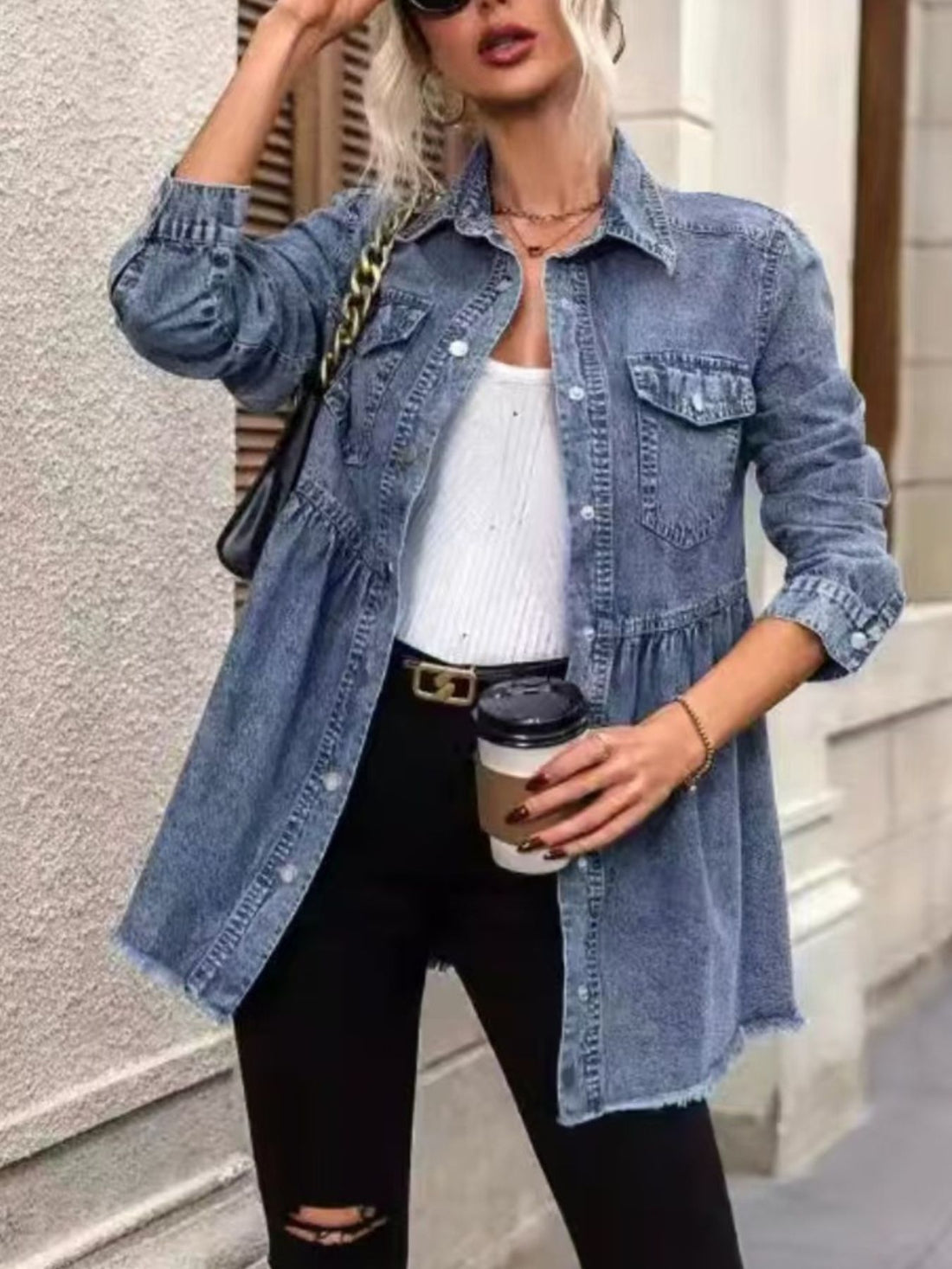 denim jacket in light blue featuring buttoned and A-line fit