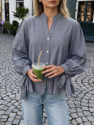100% polyester Care instructions: Machine wash cold button-up shirt in Navy with relaxed silhouette
