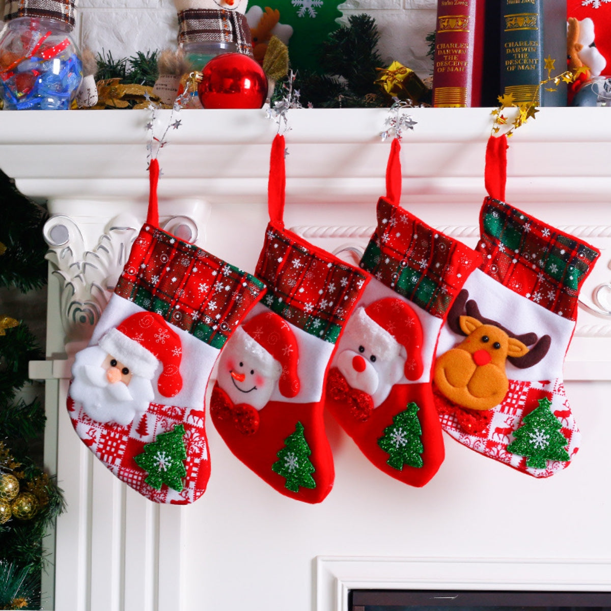 Festive Santa and reindeer Christmas stockings with snowflake and plaid patterns.