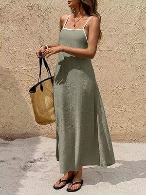 Olive spaghetti strap maxi dress with contrasting white trim and a-line cut.