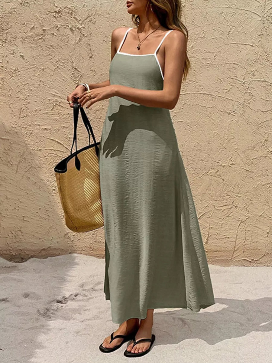Olive spaghetti strap maxi dress with contrasting white trim and a-line cut.