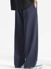 Navy blue casual drawstring sweatpants with a loose fit and pockets.