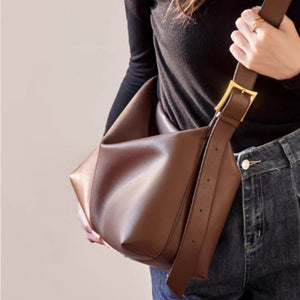 Caramel pu leather shoulder bag with gold buckle detail.