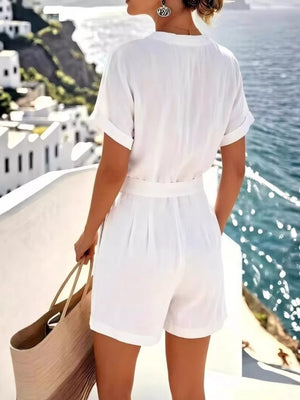 White button-down shirt with cuffed sleeves and belted shorts set.
