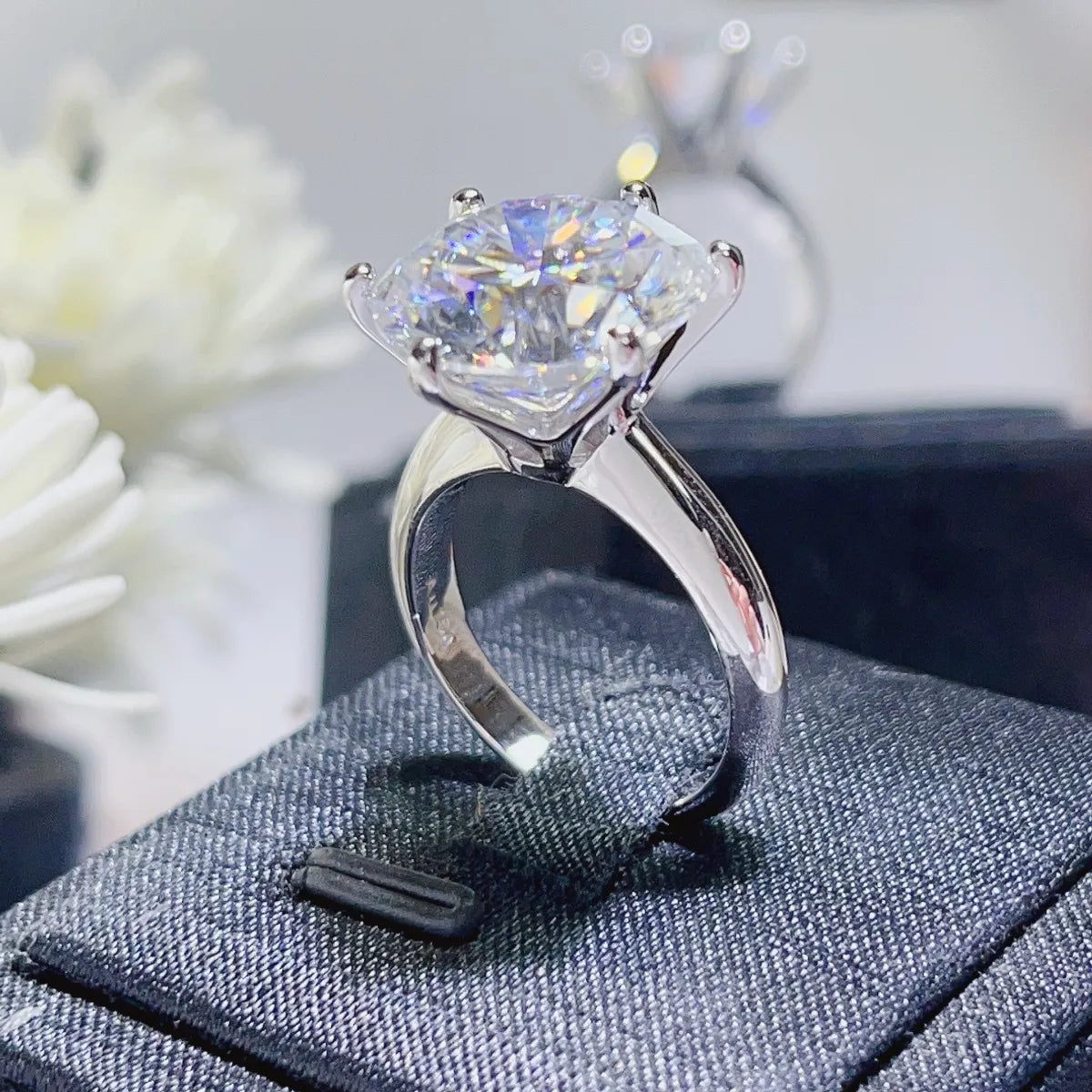 Solitaire engagement ring in 925 silver with a large radiant cut diamond.