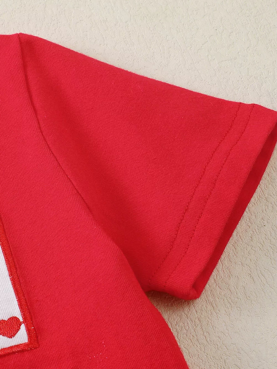 Red baby set with Xoxo heart print detail on a white patch and short sleeves.