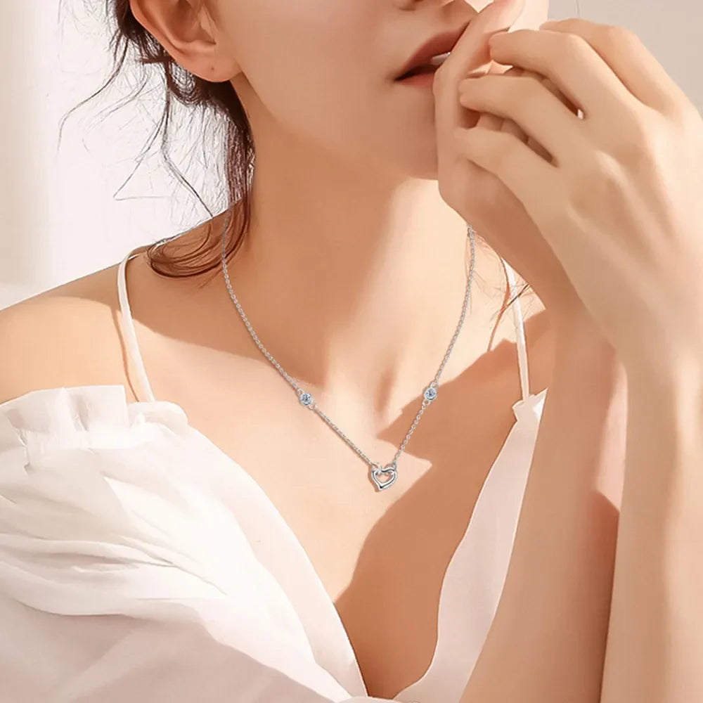 Silver linked heart pendant necklace with crystal accents