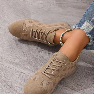 Khaki lace-up casual sneakers with all-over logo pattern and white laces.
