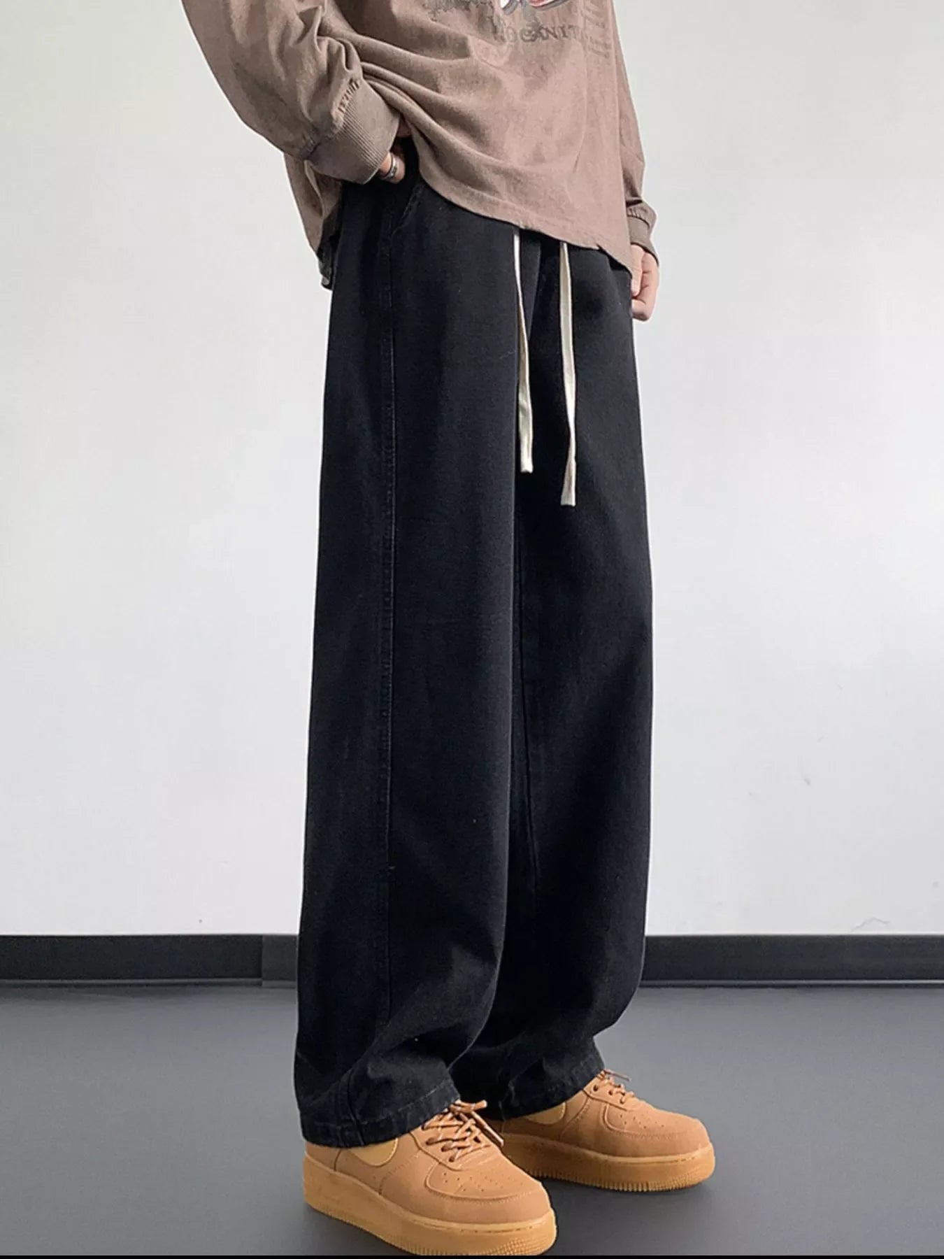 Black oversized drawstring loose fit jeans with a comfortable fit.