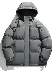 Grey oversized puffer jacket with hood and zip closure, casual winter outerwear