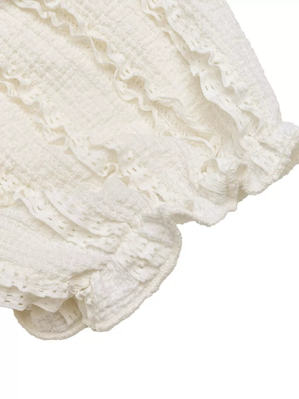White textured maternity t-shirt with ruched detailing and ruffled puff sleeves.