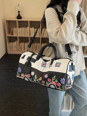 Flower Power Large Duffel Bag in black and white with colorful floral and camper van print.