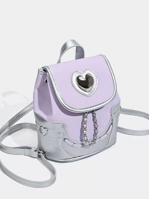 Charming mini heart flap backpack in purple with silver accents and chain detail.