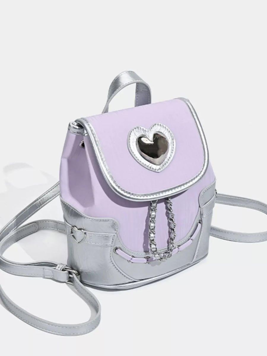 Charming mini heart flap backpack in purple with silver accents and chain detail.