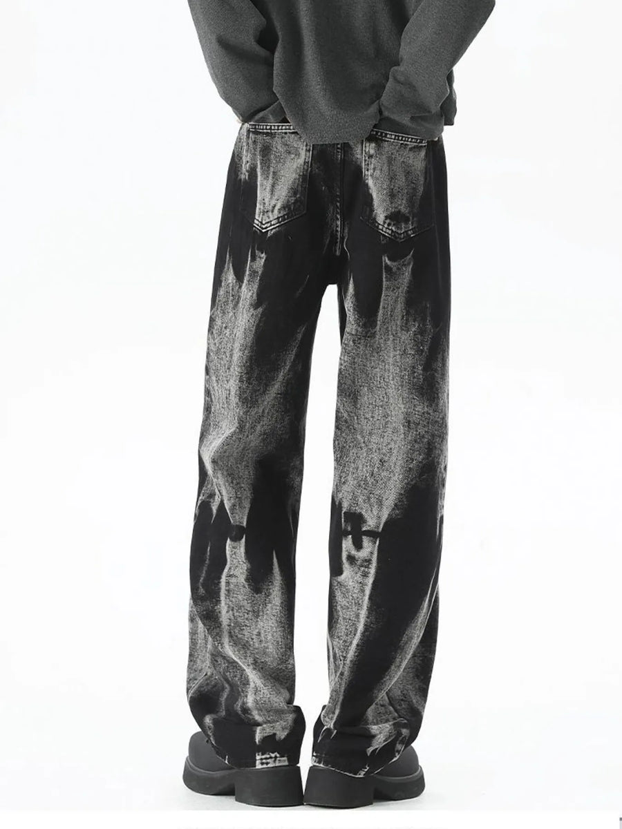 Men's black relaxed fit jeans with acid wash detail and a comfortable fit.
