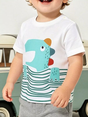 White cotton crew neck toddler tee with playful blue cartoon character and green stripe print.