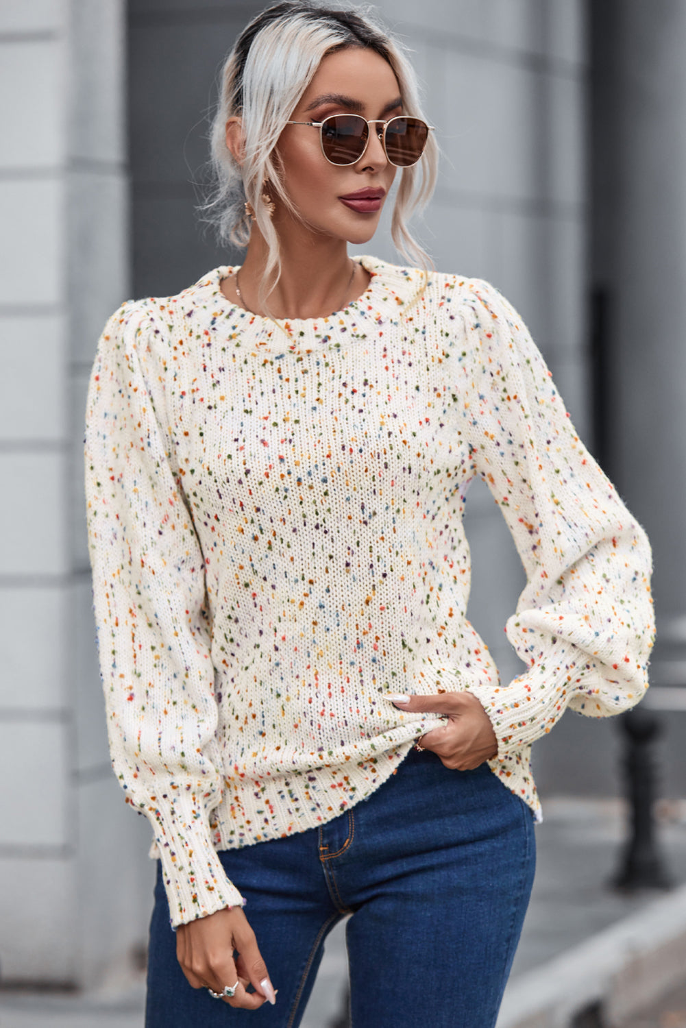 Confetti speckle puff sleeve knit sweater in cream with a round neckline and ribbed cuffs.