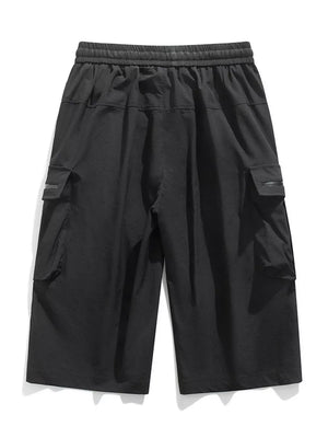 Black cargo shorts with elastic waist and zippered pockets.