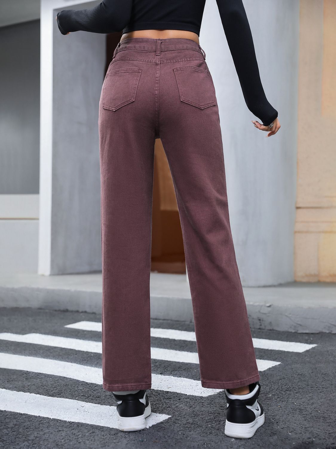Relaxed straight leg jeans in dark brown with buttoned fly and back pockets.