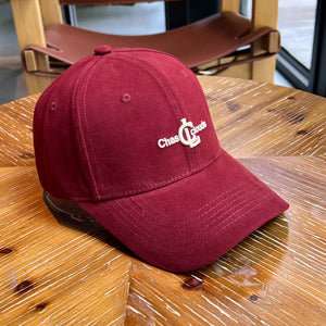 Maroon baseball cap with white embroidered "Chas Clouds" logo and stitched brim.