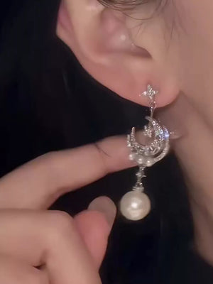 earrings in ivory with celestial and dangle