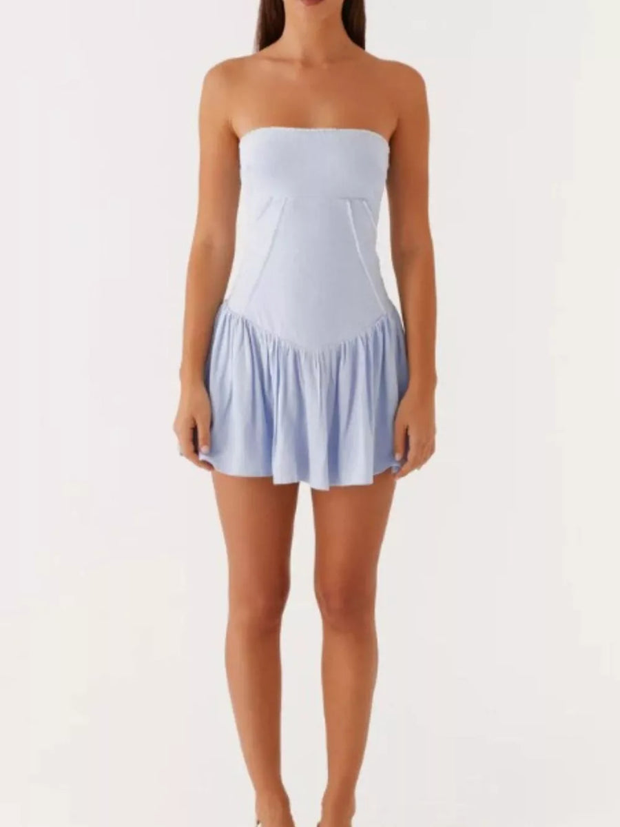 Light blue ruffled tube dress with a gathered skirt and back tie detail.