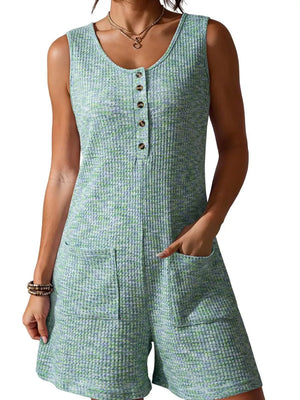 Textured button front romper in green with scoop neck and patch pockets.