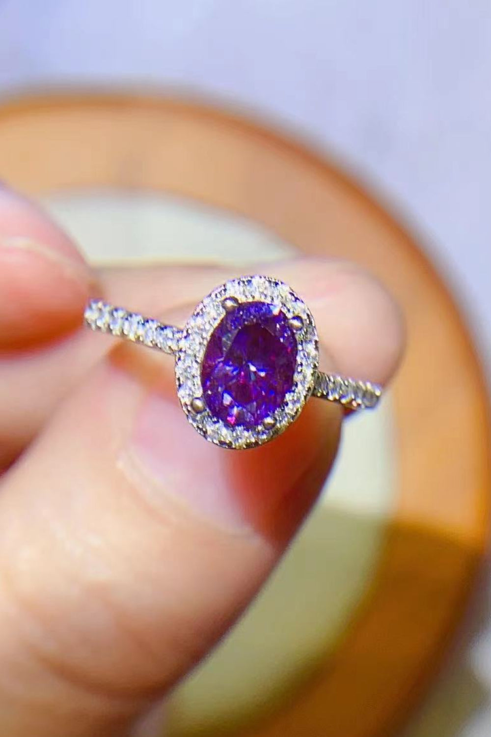 Purple moissanite oval halo ring in silver with pave band