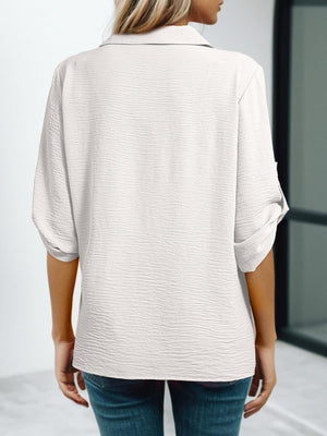 White crinkled texture Johnny collar shirt with rolled sleeves, shown from the back.