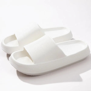 Textured white cloud slides slippers with thick soles and open toe.