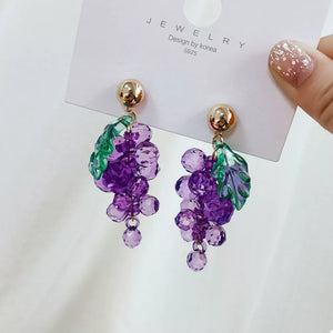 Grape-inspired beaded dangle earrings with purple acrylic beads and green leaves.