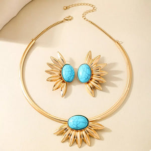 Gold sunflower jewelry set with turquoise stones, including necklace and earrings.