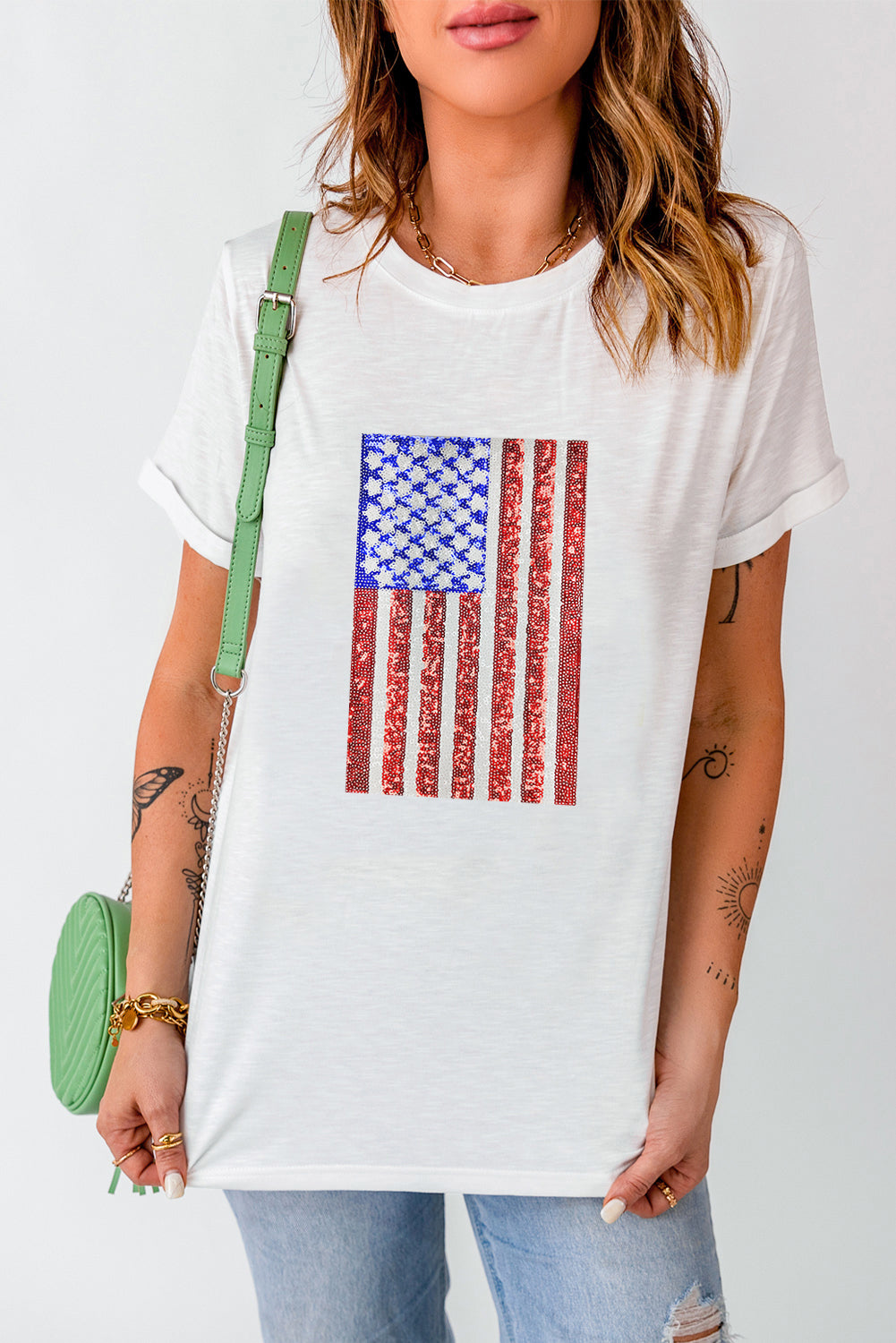 White t-shirt with sequin American flag graphic, crew neck, short sleeves.