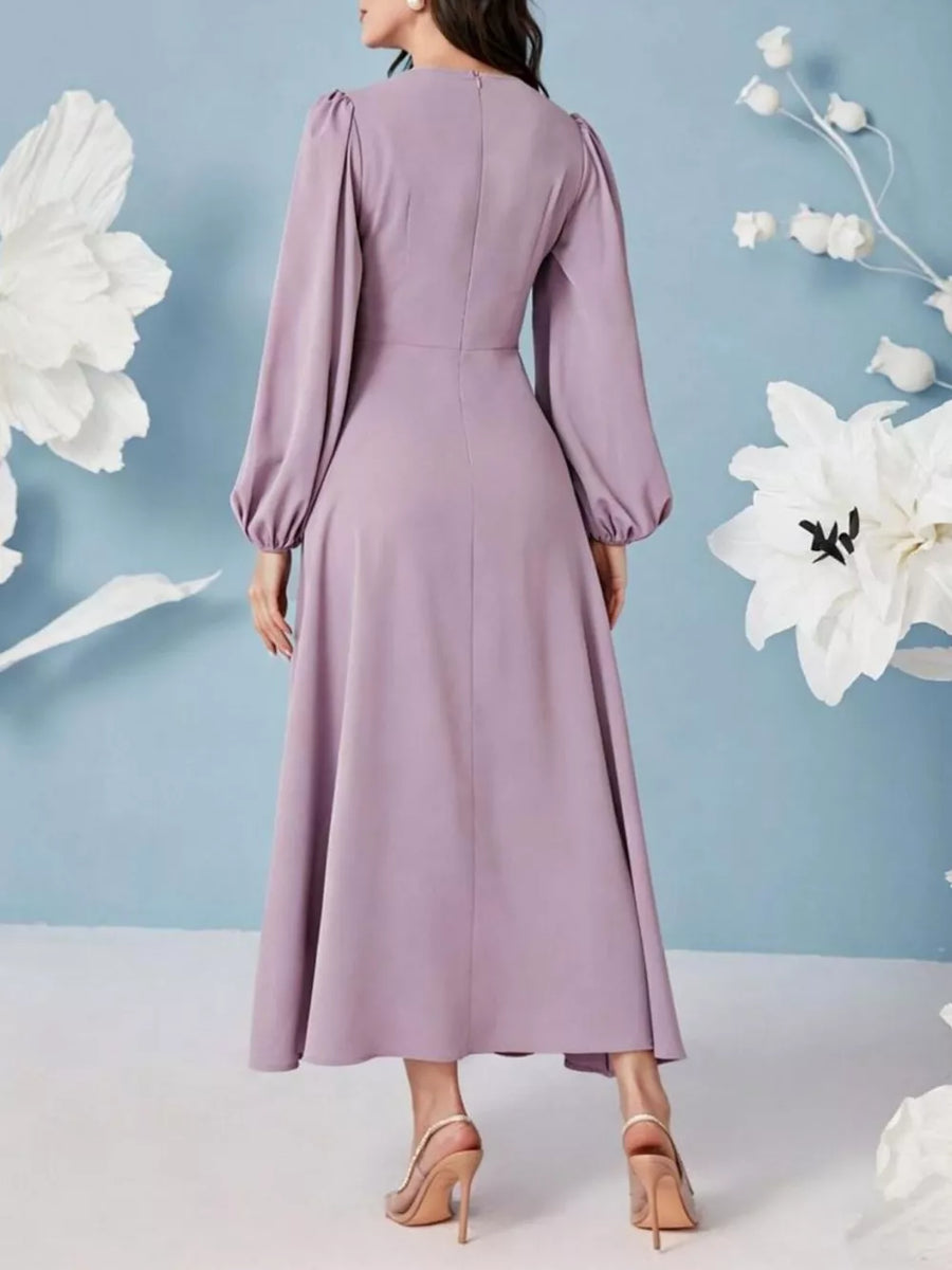 Elegant ruched maxi dress in lavender with balloon sleeves and a-line skirt.