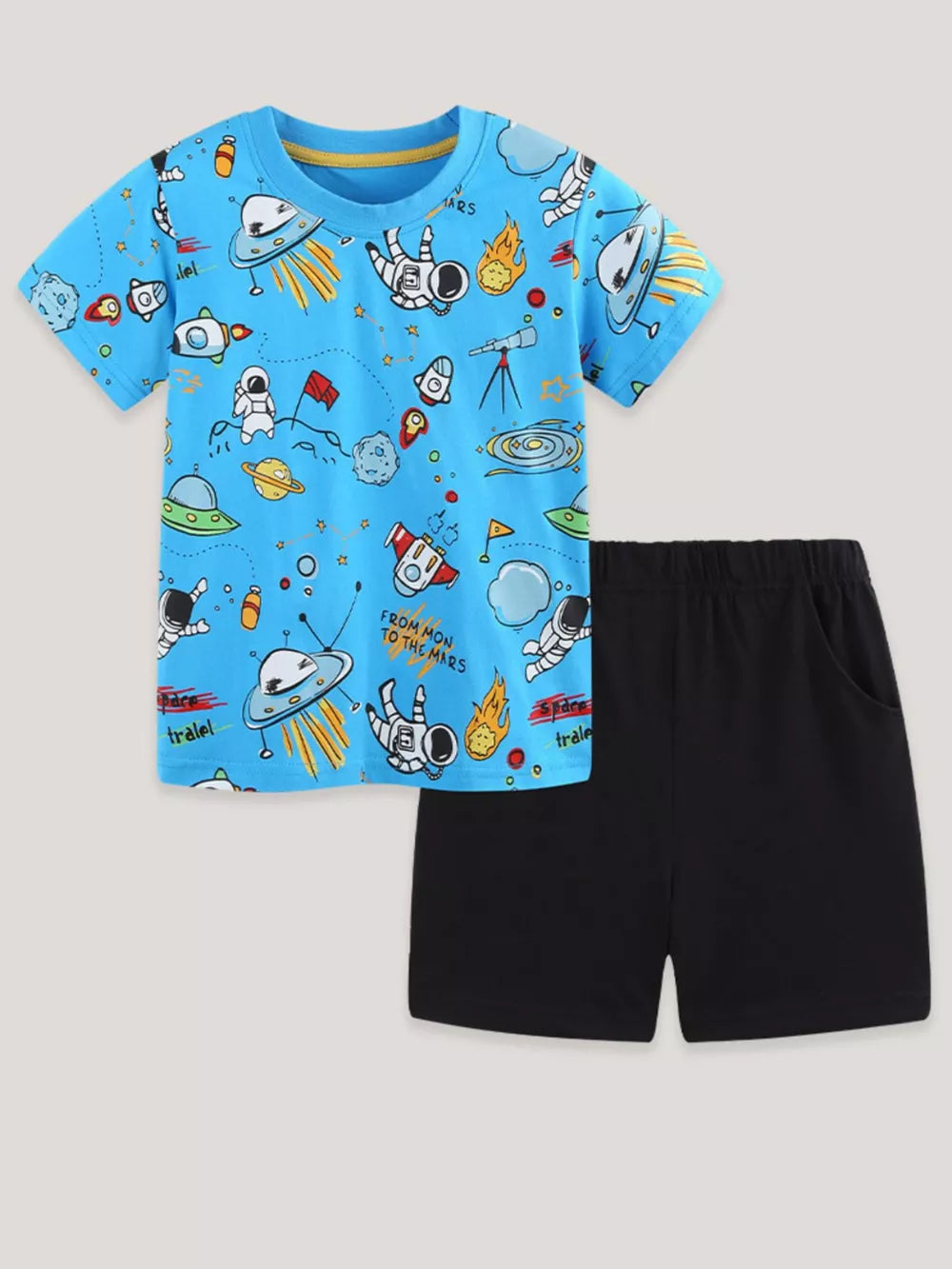 Blue cotton graphic tee with astronaut and space print, paired with black shorts.
