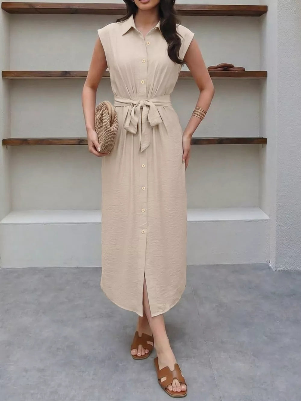 Beige midi dress with tie-waist, collared, button-down, and cap sleeves.