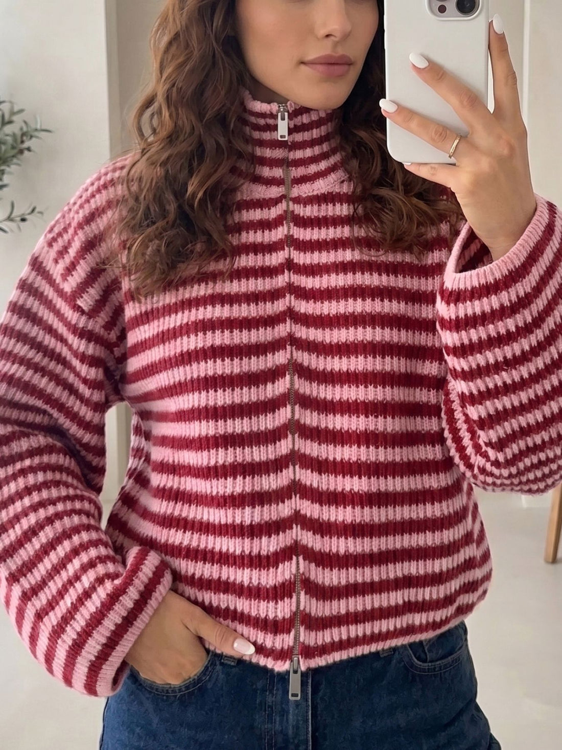 light pink zip-up sweater with striped and mock neck