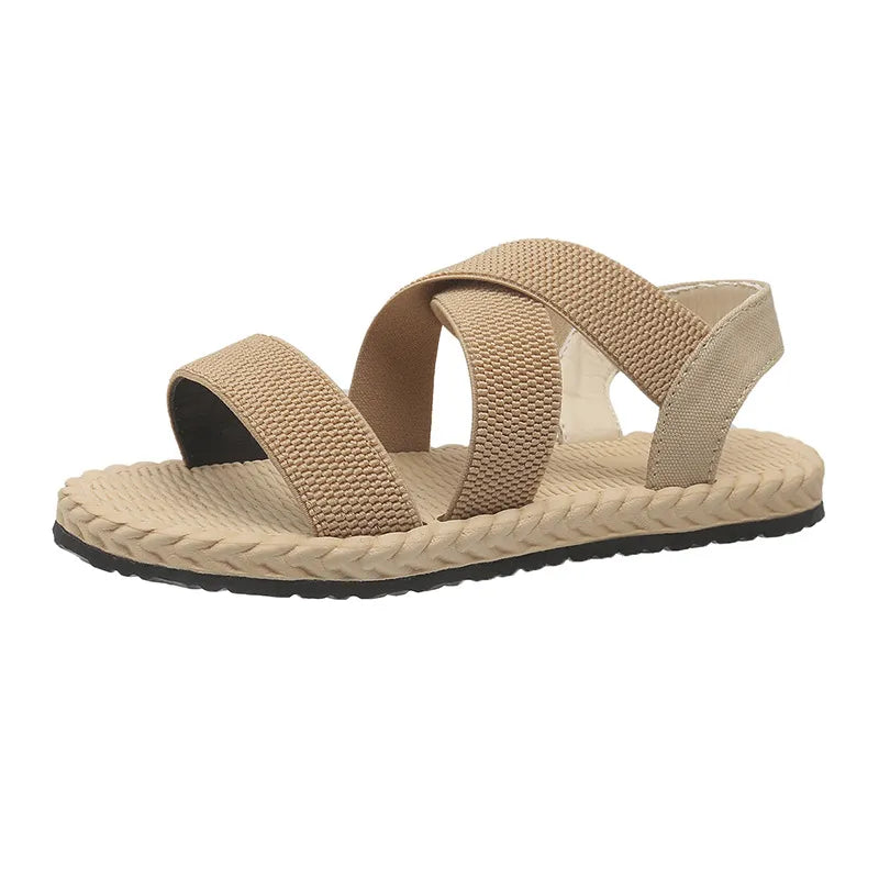 Tan crisscross elasticated summer sandals with braided sole detail.