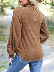 Camel button-back puff sleeve mock neck top with balloon sleeves.