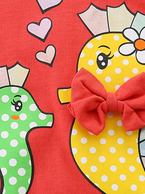 Red cotton baby top with seahorse and polka dot print, featuring a red bow.