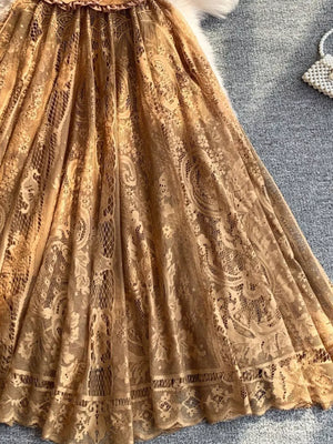 Brown lace dress with intricate floral pattern and scalloped hem detail.