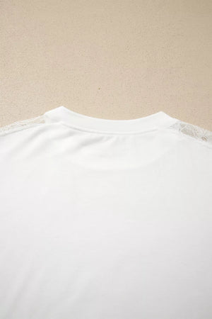 White long sleeve shirt with delicate lace shoulder detail and crew neckline.