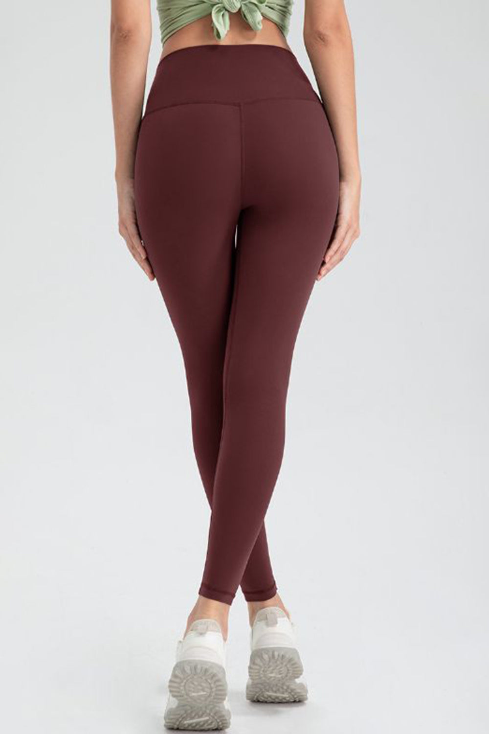 Wine high-waist performance leggings with sculpted seams and a bodycurve fit.