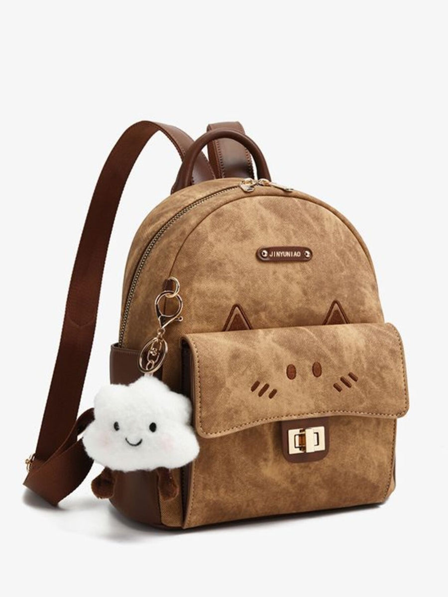 Mini cartoon cat backpack in caramel brown with adjustable straps and a cloud charm.