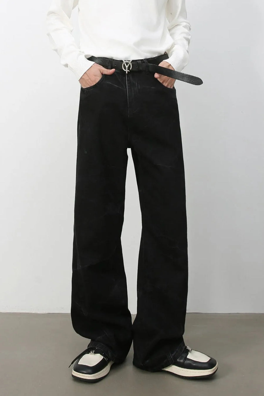 Faded black wide-leg denim jeans with a casual, baggy fit.