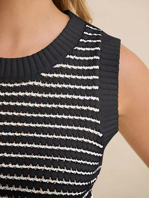 Black knit sweater vest with white horizontal stripes and textured details.