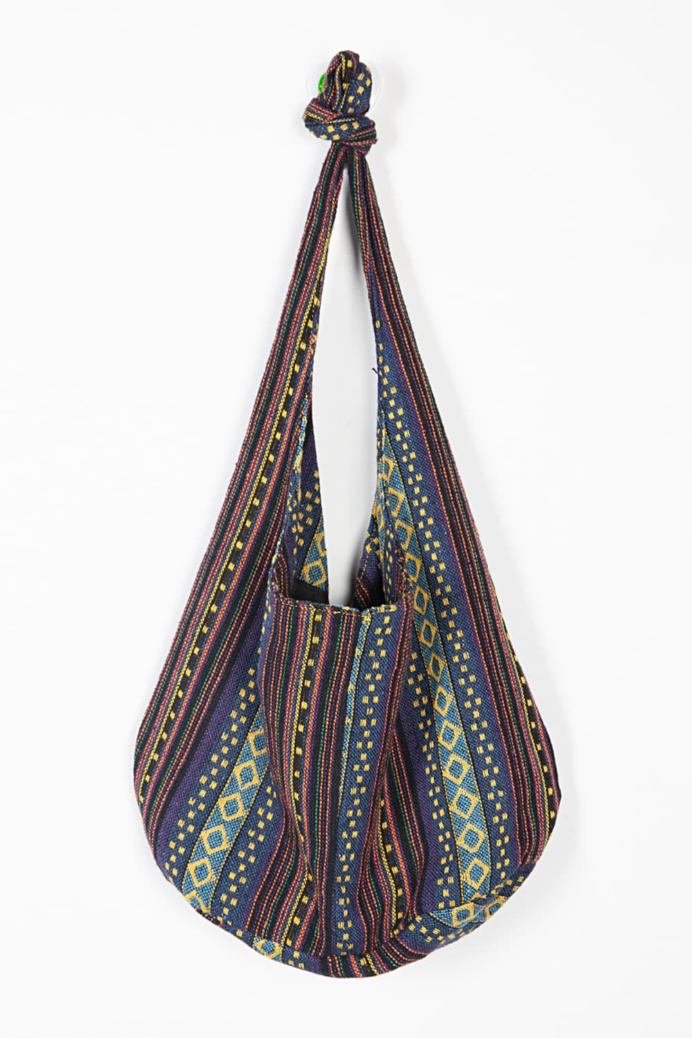 Tribal weave shoulder bag with geometric patterns in multicolor canvas.